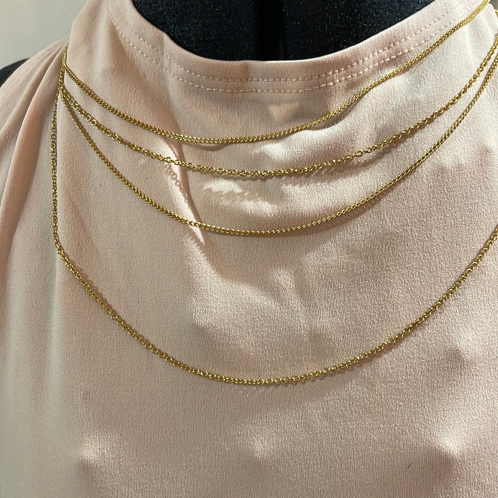 Artistry Four tier Gold tone chain.